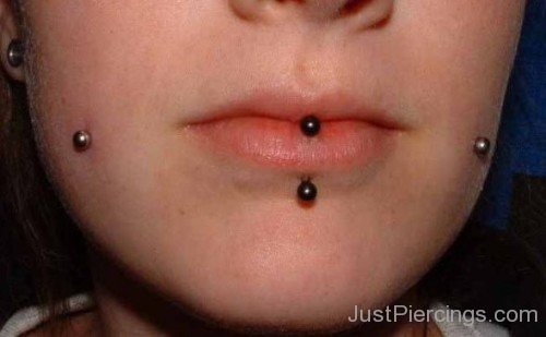 Cheek And Vertical Labret Piercing