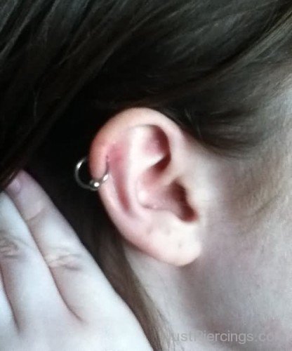 Girl Showing Her Pinna Piercing On Right Ear
