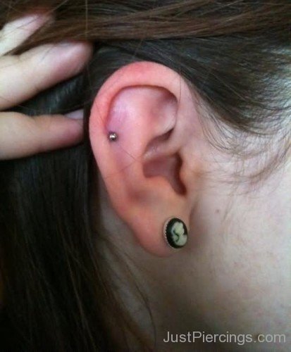 Girl With Lobe And Pinna Piercing