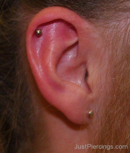 Helix Lobe Piercing With Gold Stud