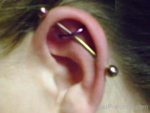 Industrial And Orbital Piercing On Left Ear