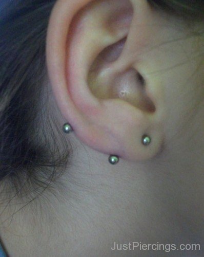 Lobe Transverse Piercing With Small Silver Barbell