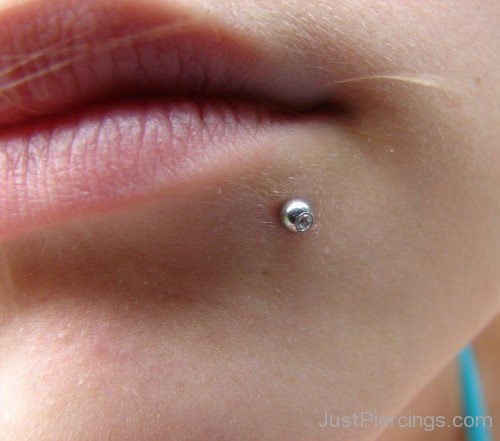 Lower Lip Piercing With Steel Stud