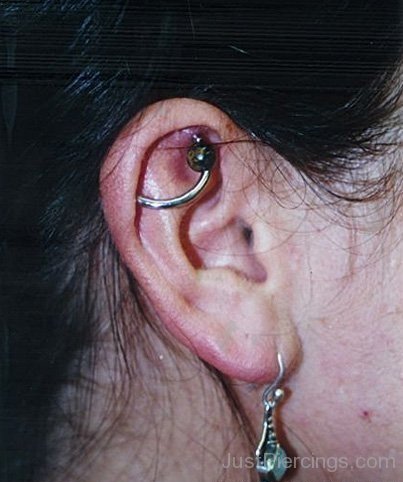 Orbital And Lobe Piercing With Earing