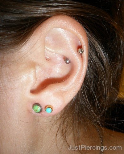 Snug Piercing And Dual Lobe Piercing With Green And Sky Blue Stud