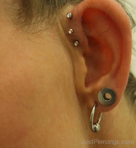 Triple Pinna Piercing On Left Ear