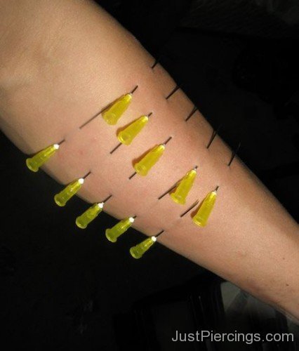 Arm Piercing With Yellow Injection Needles-JP12320