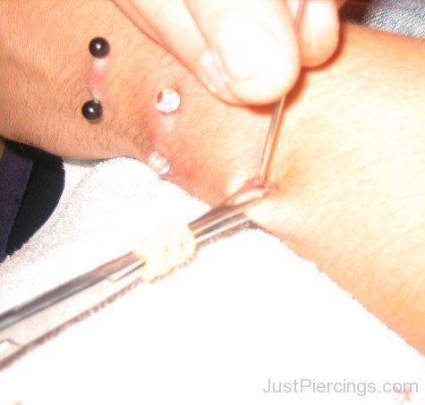 Arm piercing With Black & White Barbells-JP12310