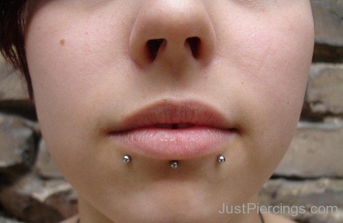 Devil Bites Piercing With Silver Studs