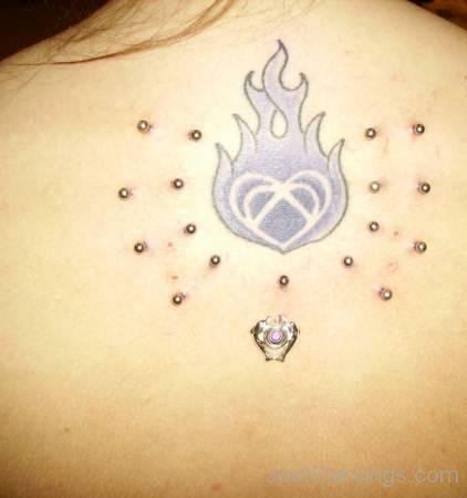 Flaming Heart Tattoo And Stud Piercings On Back-JP12315