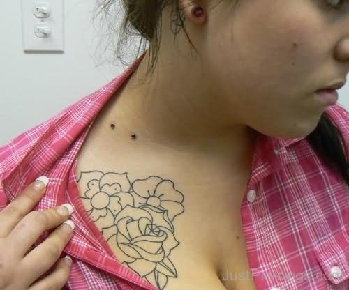 Outline Flower Tattoo And Vampire Bites Piercing.