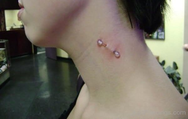 Vampire Bites Piercing With Transparent Barbell.