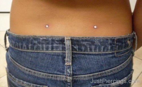 Back Dimple Piercing With Silver Micro Dermals