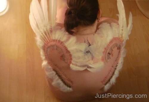 Feather Piercing On Girl Back-JP12310