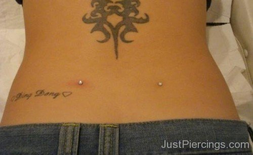 Grey Ink Tattoos And Dimple Piercing On Back-JP12328