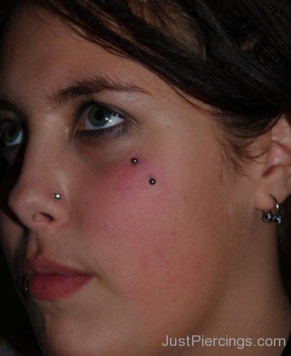 Lip, Nose, Lobe And Butterfly Kiss Piercing