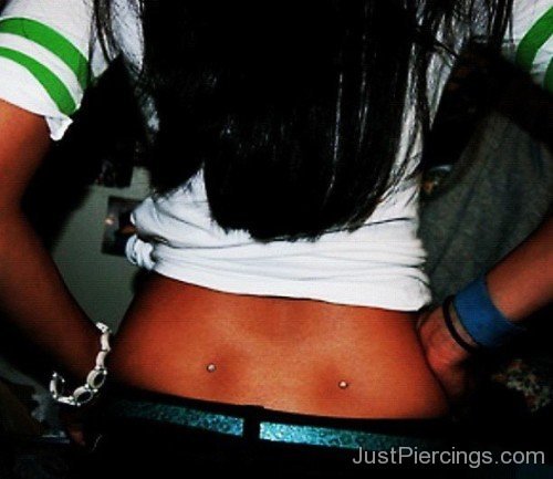 Lower Back Dimple Piercing With Dermals-JP12330