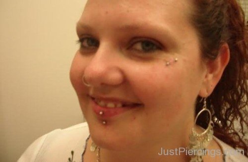 Smiling Girl With Vertical Labret And Teardrop Piercing-JP12327
