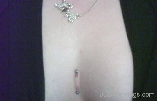 Beautiful Sternum Piercing With Surface Barbell