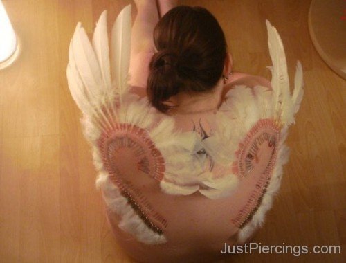 Feather Piercing On Back