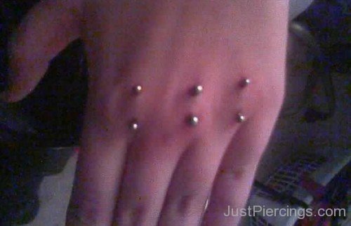 Knuckle Surface Piercings With Barbell