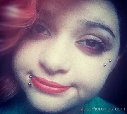 Lower Lip And Butterfly Kiss Piercing