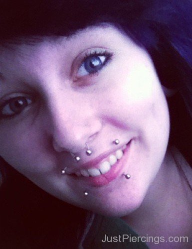 Septum And Canine Bites Piercing With Silver Circular Barbells