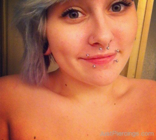 Septum And Canine Bites Piercings With Silver Barbells