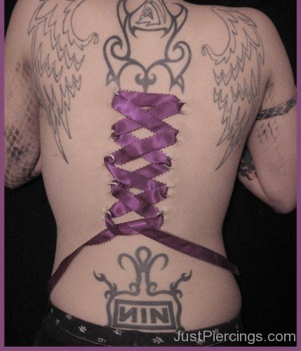 Wings Tattoo & Corset Piercing On Back