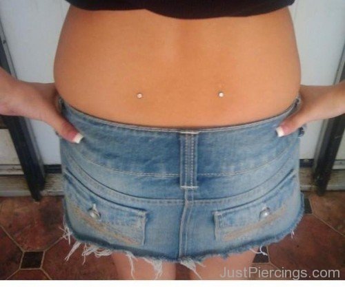 Young Girl With Back Dimple Piercing