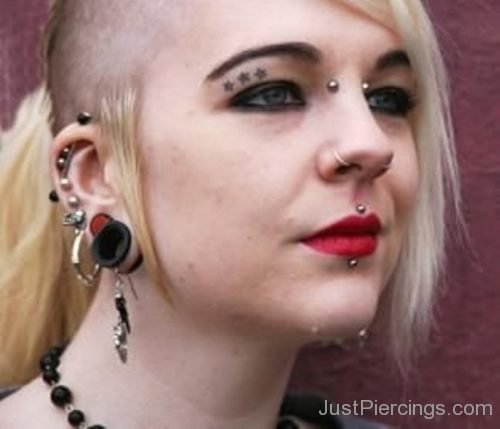 Girl With Lip, Bridge, Eye And Cartilage Ear Piercings-JP1069