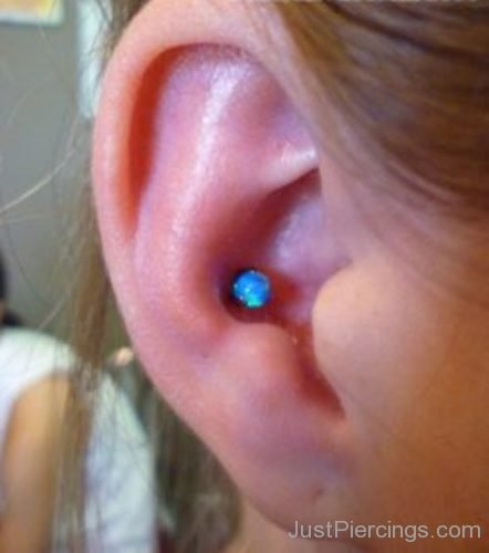Conch Piercing On Ear With Blue Barbell-JP1086