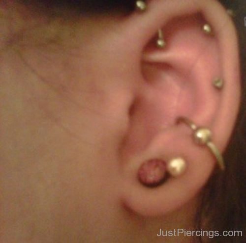 Conch,Anti Helix,Helix And Lobe Piercing With Gold