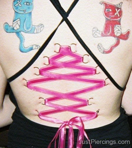 Corset Piercing And Cartoon Tattoo On Back-JP1046