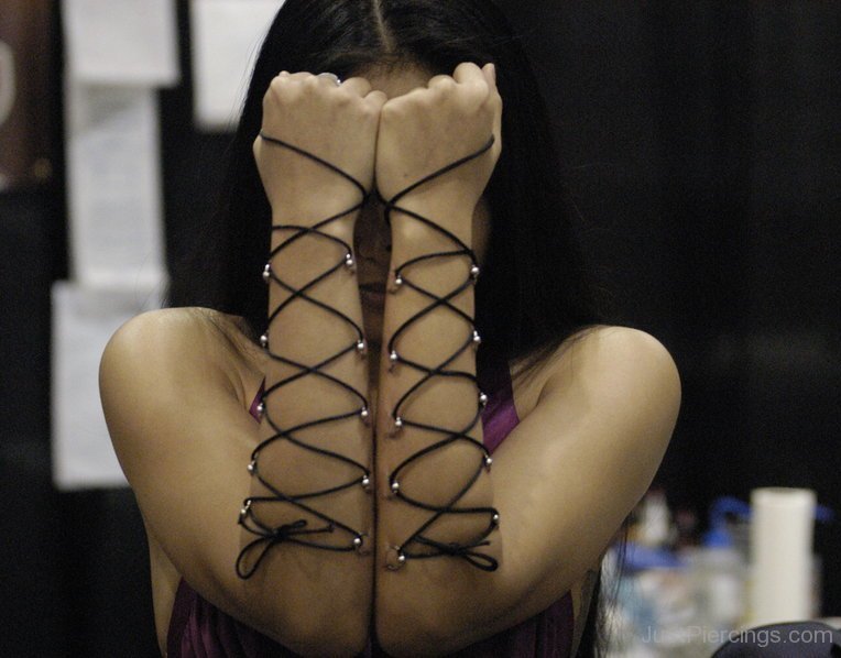 Corset Piercing On Girl Arms.