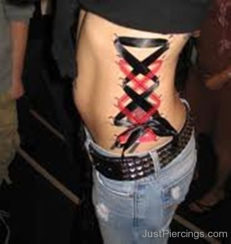 Corset Piercing With Black And Red Ribbon On Side Rib