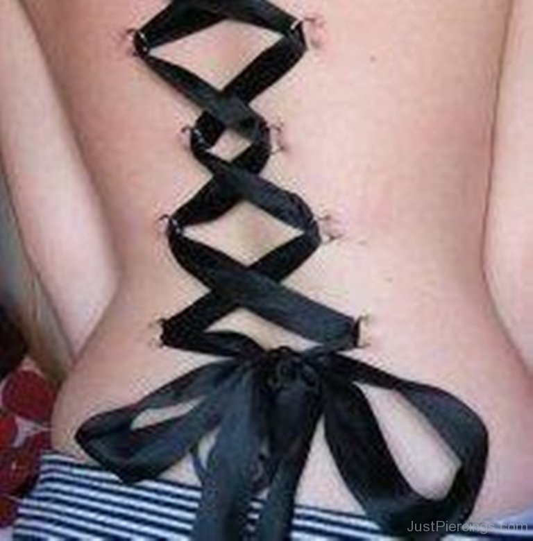 Corset Piercing With Black Ribbon.