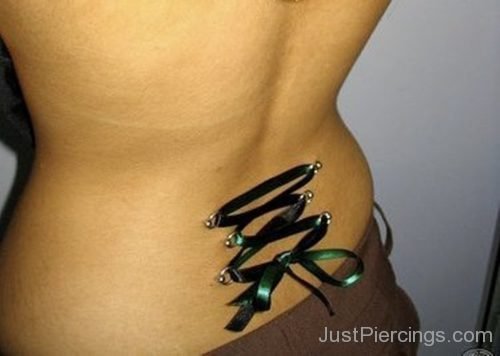 Corset Piercing With Green Ribbon On Lower Back-JP1090