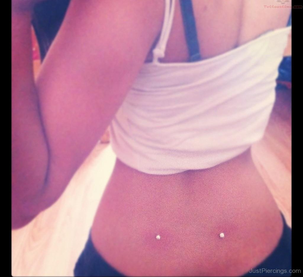 Dimple Piercing On Girl Back.