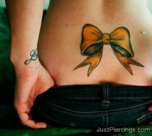 Micro Dermals Back Dimple Piercing And Bow Tattoo-JP166
