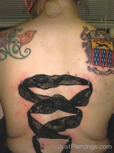 Shoulder Tattoos And Ribbon Corset Piercings-JP1128