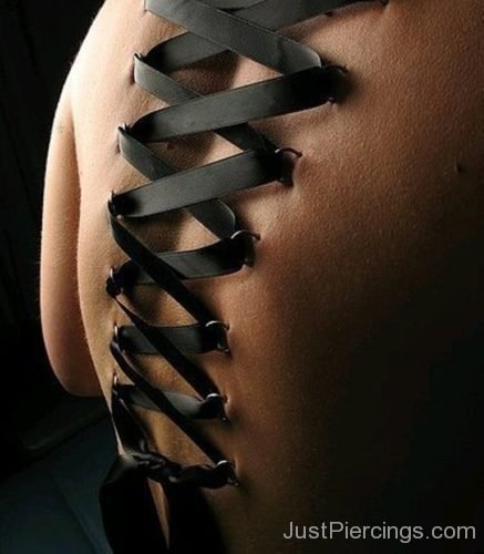 Corset Piercing With Black Ribbon