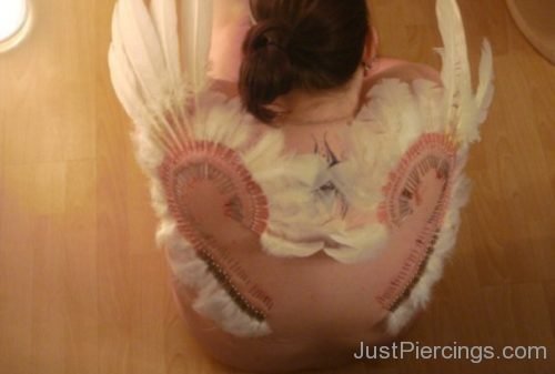 Feather Piercing On Girl Back-Jp112