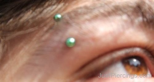 Vertical Eyebrow Piercing With Green Surgical Barbell-JP1343