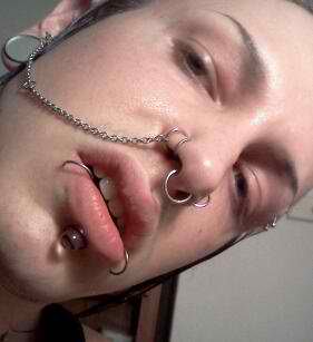 Multiple Nose Lip and Ear Piercings